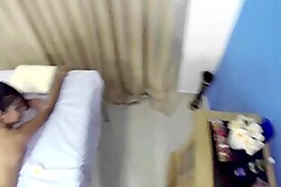 Skinny Oriental allows masseur to roam her naked body