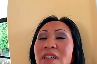 Asian MILF gets her wet pussy fucked