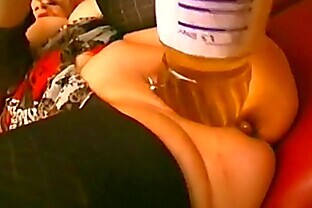Lovely woman riding a huge bottle