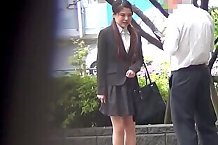 Embarrassed asian pissing outdoors
