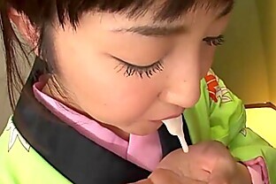 Asian bitch in a kimono sucking on his erect prick